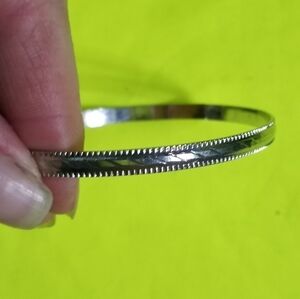 Silvertone large 2.75 i.d. solid Bangle bracelet diamond cut